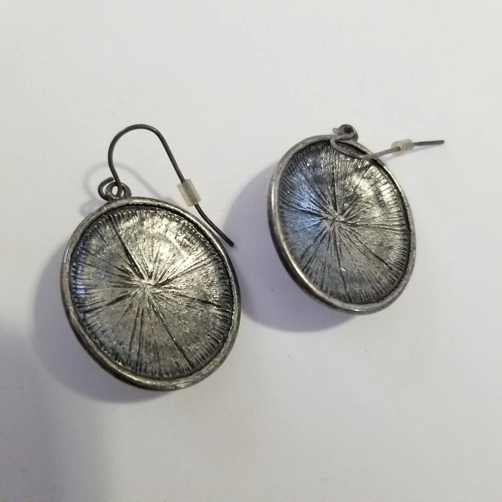 silver tone starburst dangle earrings
